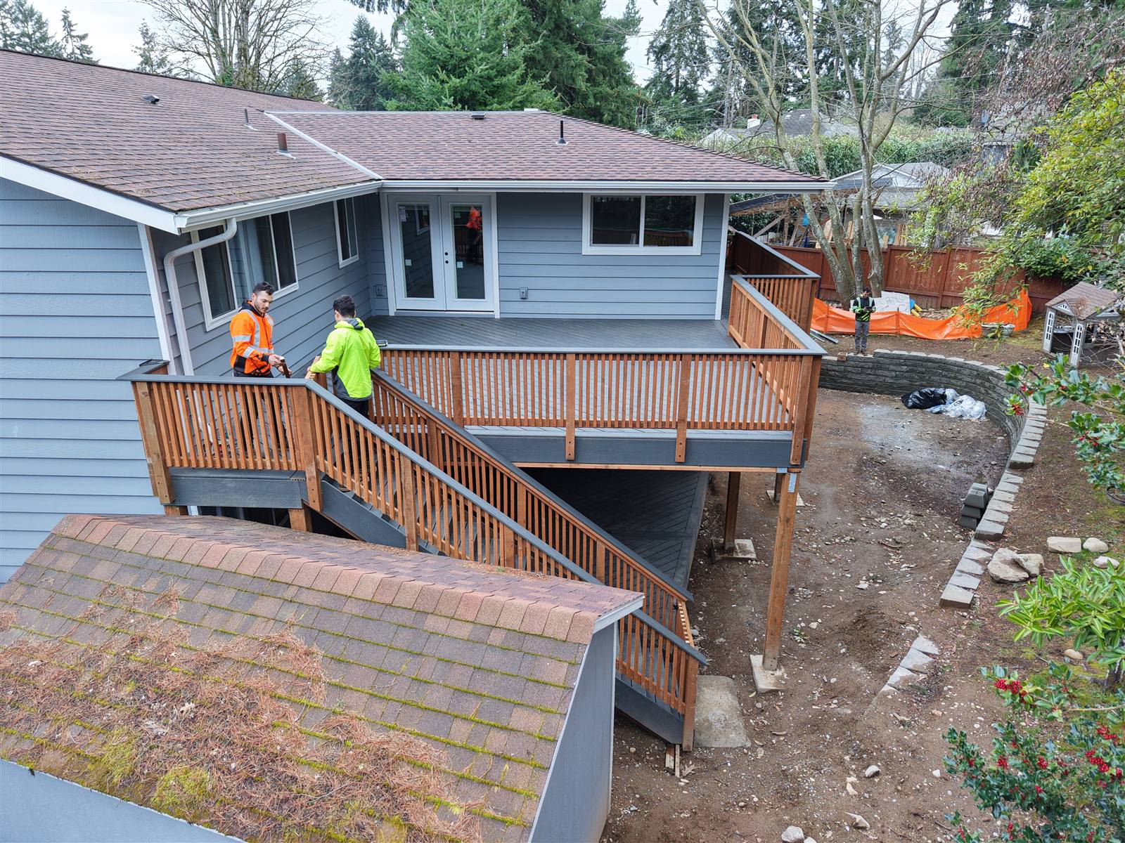 TBG crew on deck and stair framing for a Seattle home addition